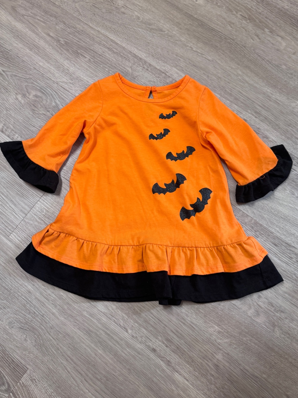 Girls Orange & Black Bat Ruffle Dress